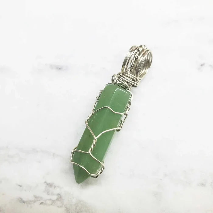 Sterling Silver Messy Wire Wrap Gemstone Crystal Pendant featuring a green crystal with intricate wire wrapping.