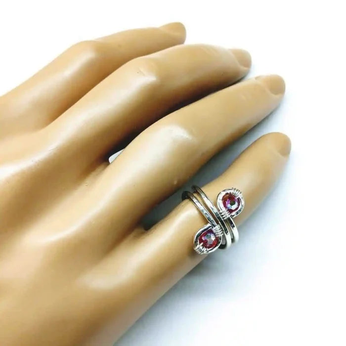 Sterling Silver Red Pink Crystal Adjustable Finger Toe Ring on a hand, showcasing its elegant design and craftsmanship.