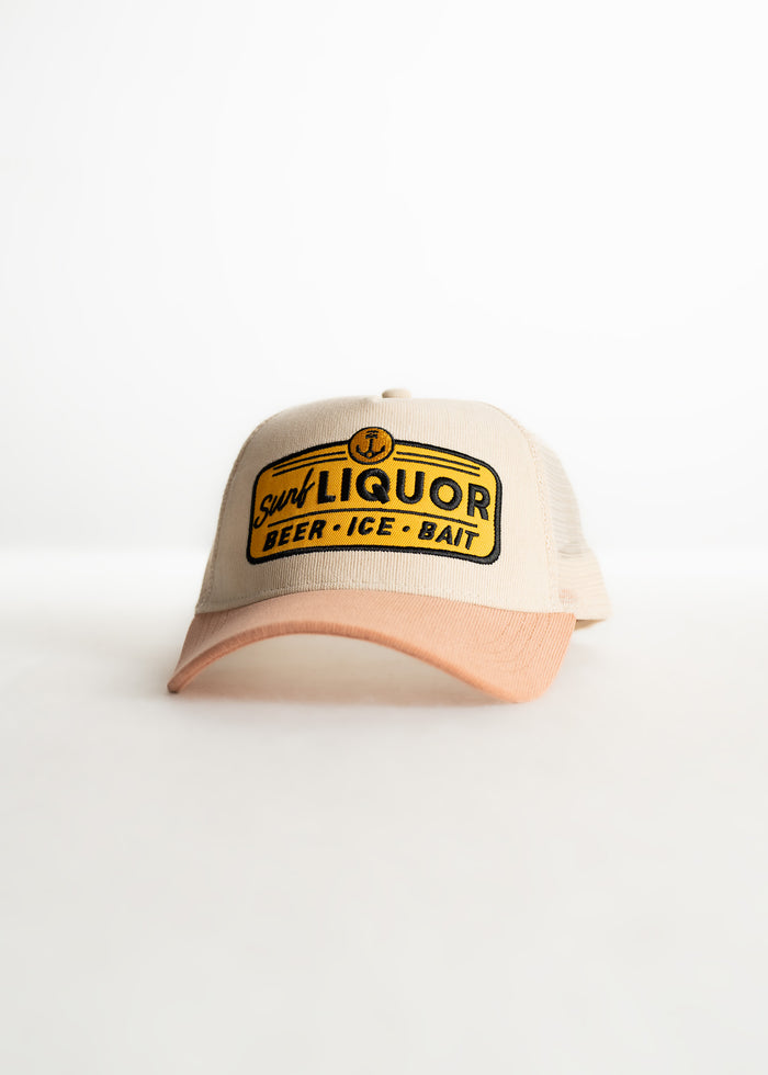 Beige cap with "Surf Liquor" logo, featuring "Beer, Ice, Bait" text. The cap has a curved peach brim on a white background.