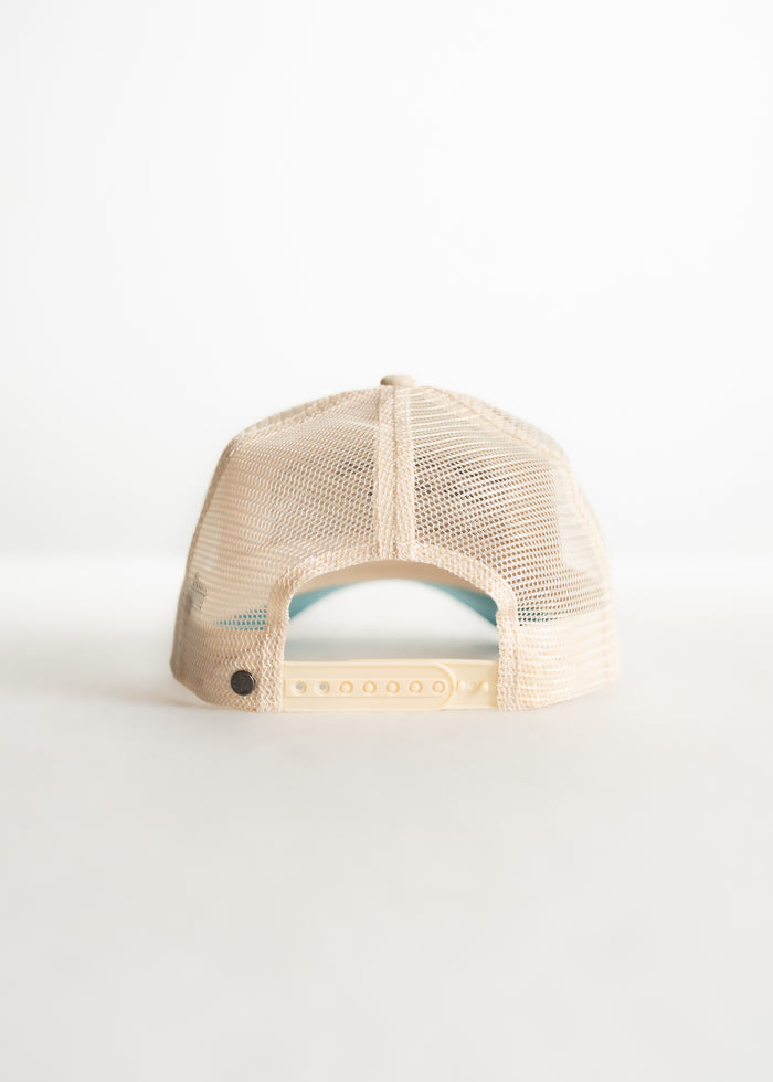 Back view of a beige mesh trucker hat with adjustable snap closure on a plain white background.
