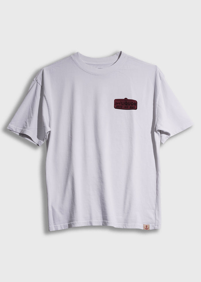 White T-shirt with a small red and black "Surf Liquor" logo on the chest, displayed against a plain background.
