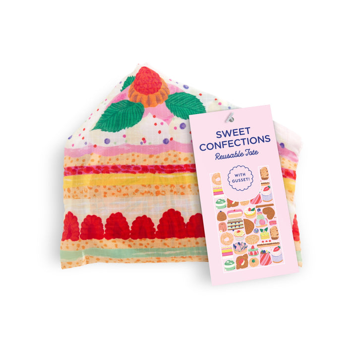 The Emily Taylor Sweet Confections Packable Nylon Tote Bag features a dessert-themed design with colorful cakes and raspberries, is reusable, eco-friendly, and folds up with a tag displaying its name.