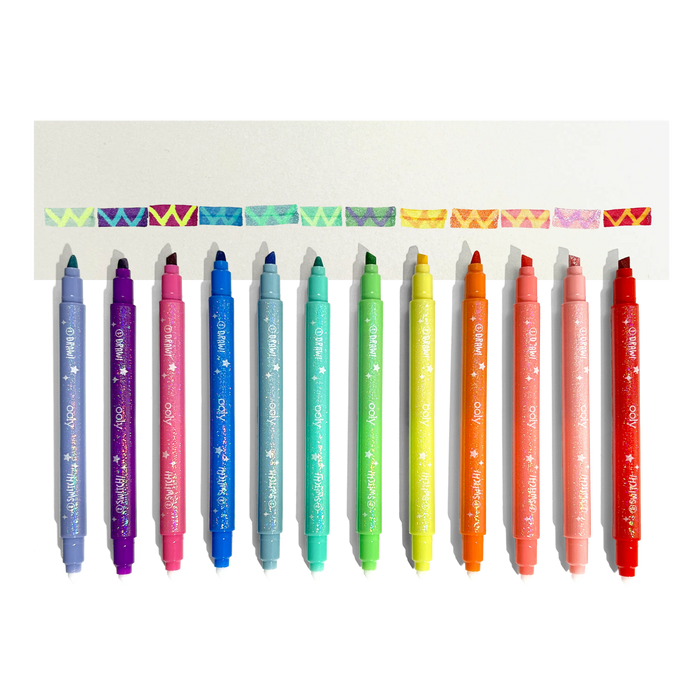 Row of uncapped markers and color changed swatches from OOLY Switch-Eroo Sparkle Glittery Color Changing Markers