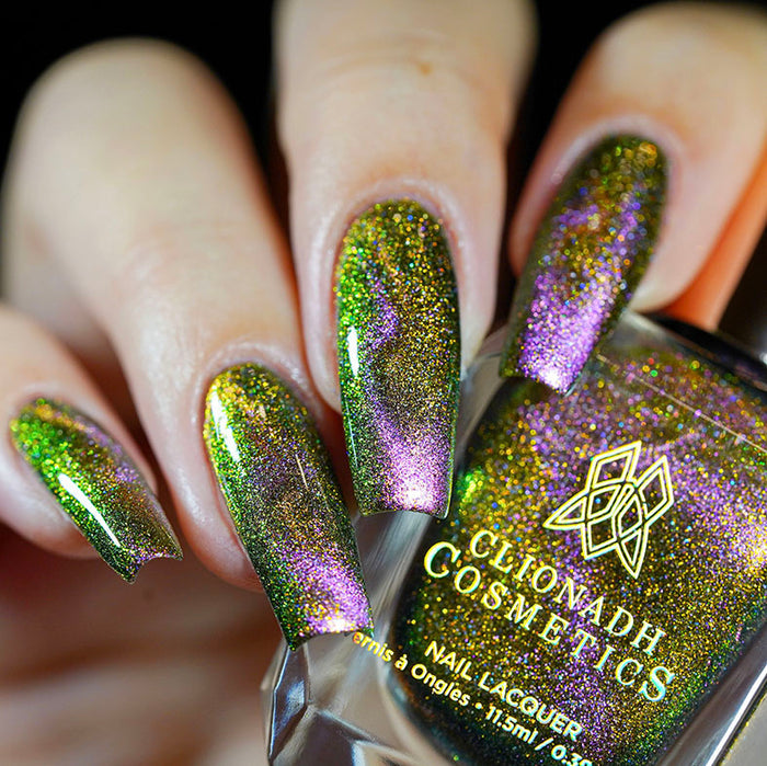 Close up of nails done with Synesthesia Nail Lacquer featuring a design to show off the magnetic effect on fair skin tone