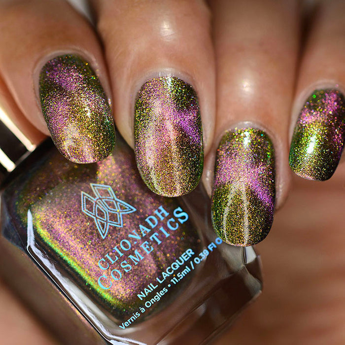 Close up of nails done with Synesthesia Nail Lacquer featuring a design to show off the magnetic effect on medium skin tone