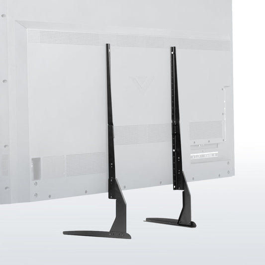 Two black TV stands against a white wall with a textured pattern.