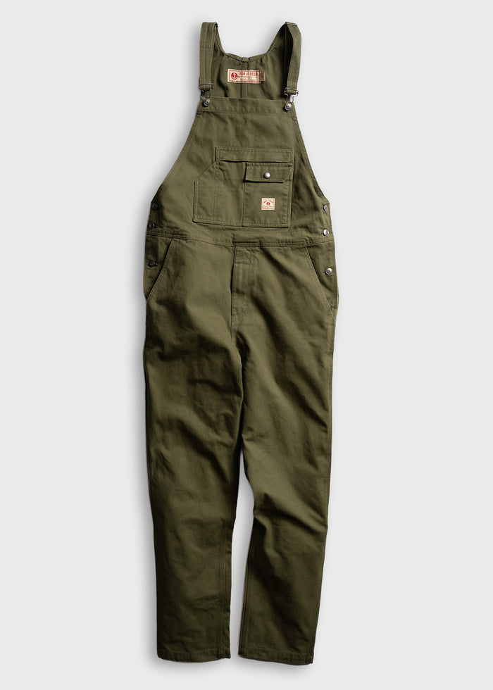 Green cotton overalls with adjustable straps and multiple pockets, displayed on a white background for a casual workwear look.