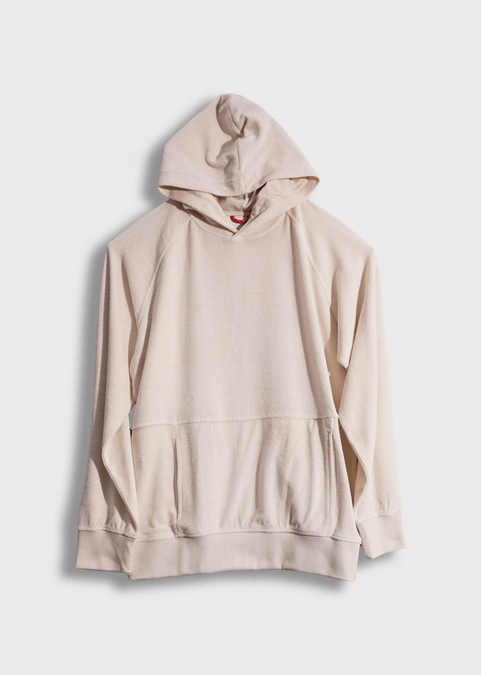 Cream-colored hoodie with a front pocket and hood, displayed against a plain white background, showcasing casual style.
