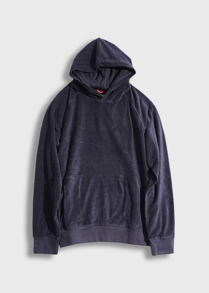 Dark blue hoodie with a front pocket and hood, laid flat on a light gray background, showcasing its casual style.