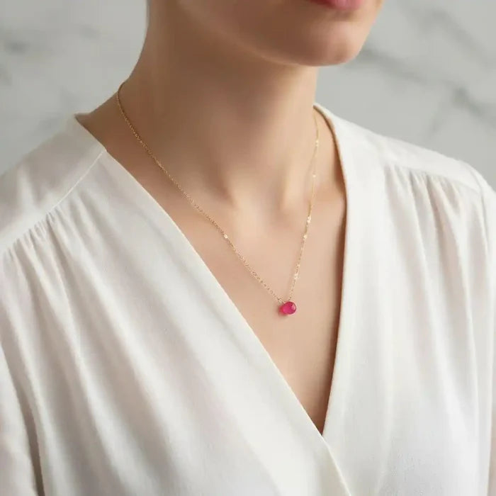Tiny Hot Pink Chalcedony Gold Filled Necklace worn by a model, showcasing its vibrant color and elegant design.