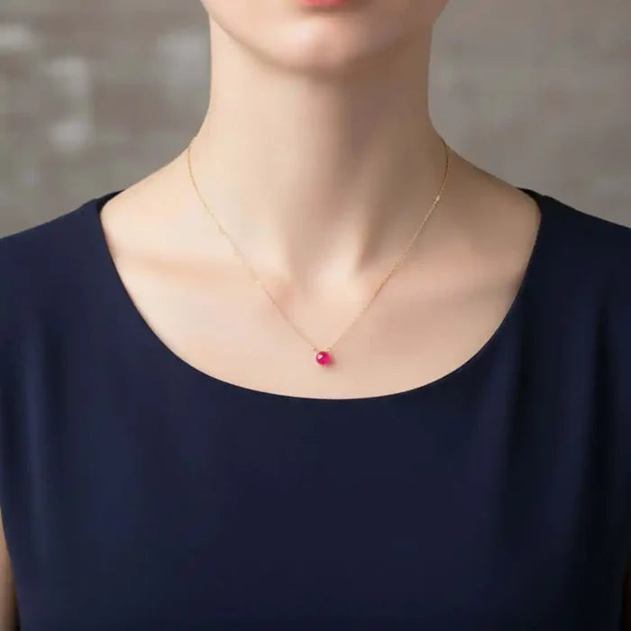 Tiny Hot Pink Chalcedony Gold Filled Necklace worn by a model, showcasing its vibrant pink color and elegant design.