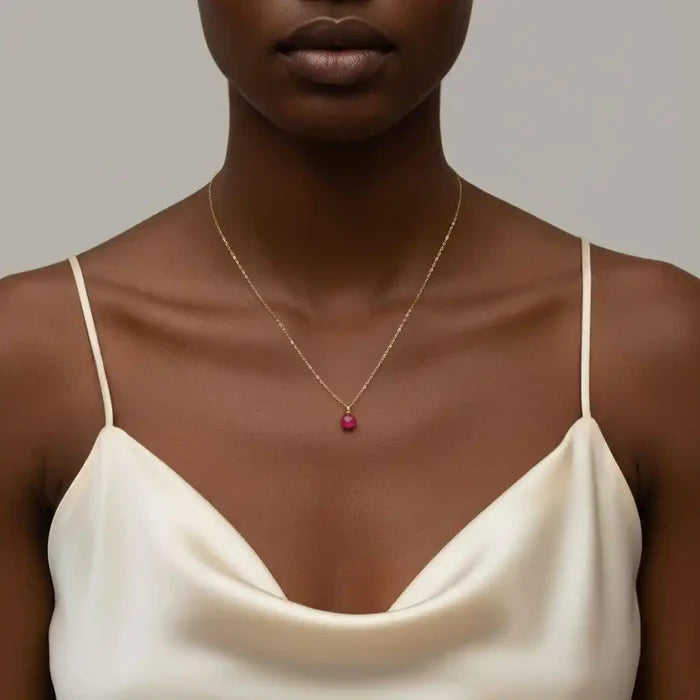 Tiny Hot Pink Chalcedony Gold Filled Necklace worn by a model, showcasing a vibrant pink drop on a delicate chain.