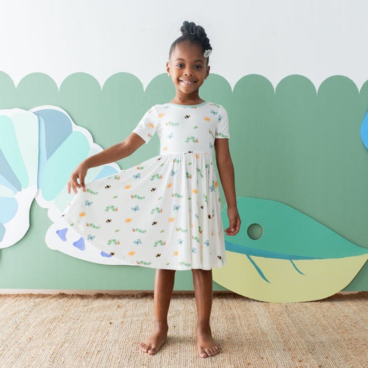 Girl wearing Kyte Baby Twirl Dress in The Very Hungry Caterpillar™ and Friends