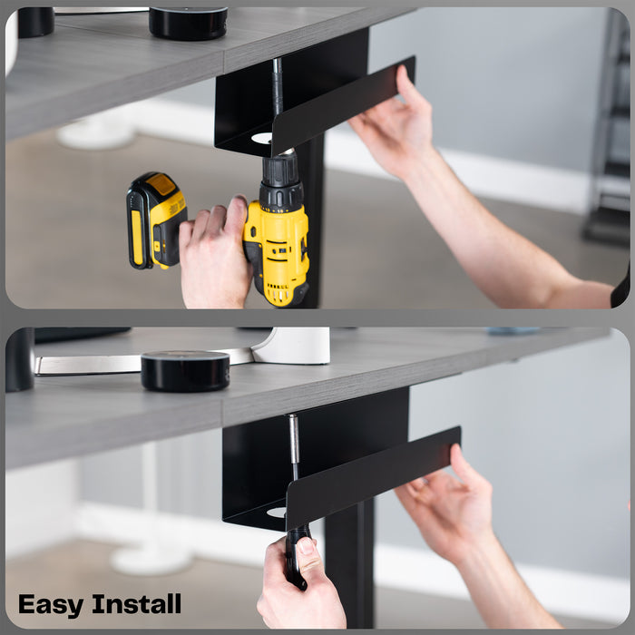 Person using a drill to install a black bracket on a desk.