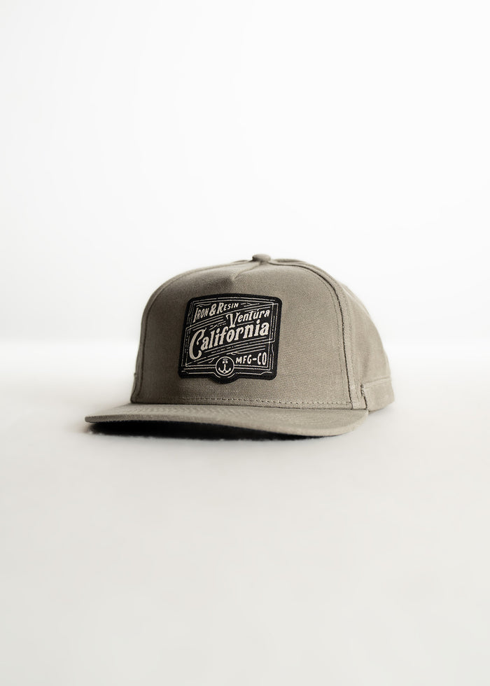 Gray cap with "Ventura, California" patch on front, displayed against a white background, highlighting its casual style.