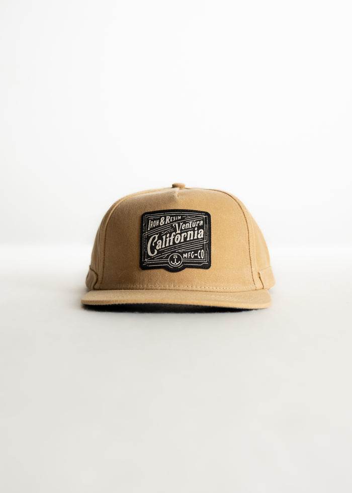 Tan cap with "Ventura California" patch, displayed on a white background. Simple design, casual style.