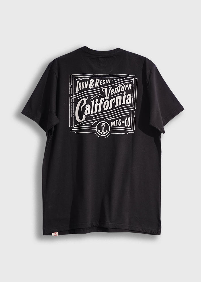 Black T-shirt with white "Iron & Resin Ventura California MFG CO" graphic on the back, displayed against a plain background.