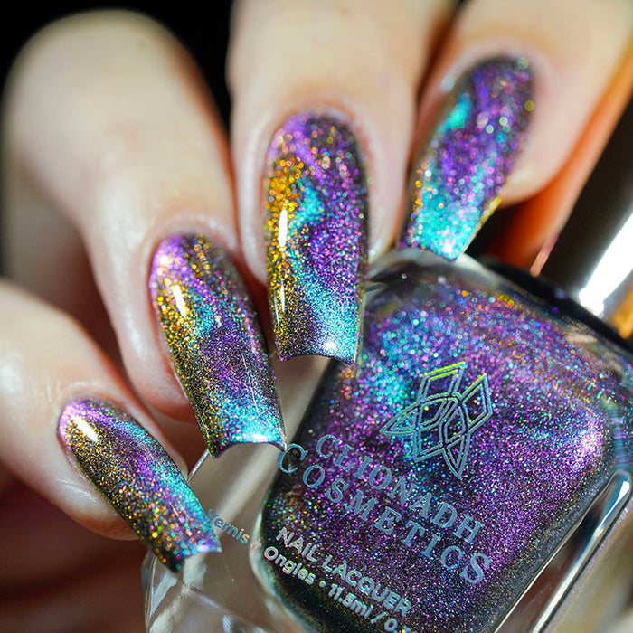 Close up of nails done with Warped Nail Lacquer featuring a design to show off the magnetic effect on fair skin tone