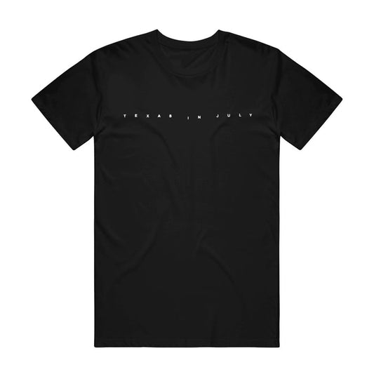 Black t-shirt with "TEXAS IN JULY" printed in small white font in the center.