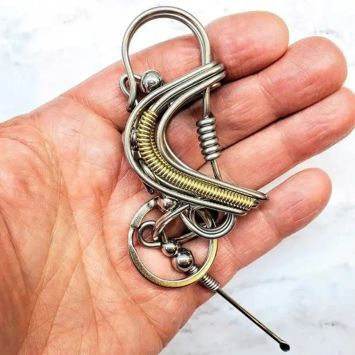 Wire Coiled Birdie Keychain For Him - Limited Edition in a hand, showcasing its unique handmade design and craftsmanship.