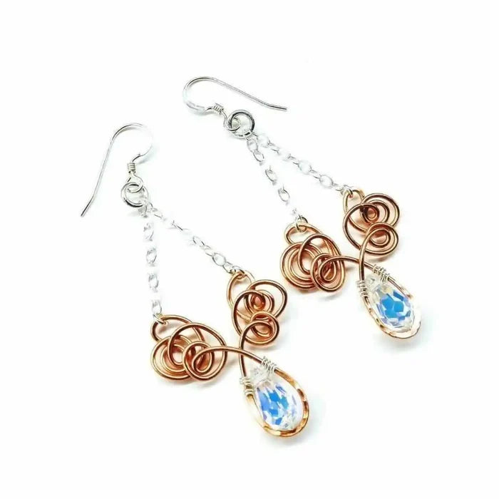 Wire Sculpted Crystal Drop Chandelier Angel Wing Earrings featuring unique wire designs and sparkling crystals.