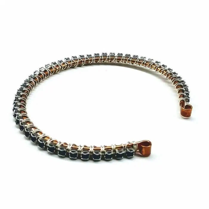 Wire Wrapped Copper Silver Black Crystal Rhinestone Bangle elegantly displayed on a white background.