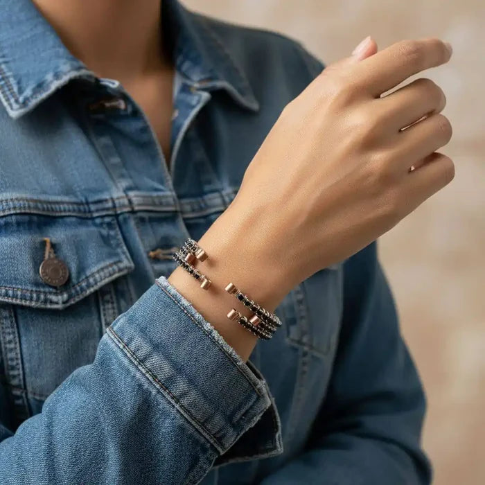 Wire Wrapped Copper Silver Black Crystal Rhinestone Bangle worn on a hand, showcasing elegant design with crystals.