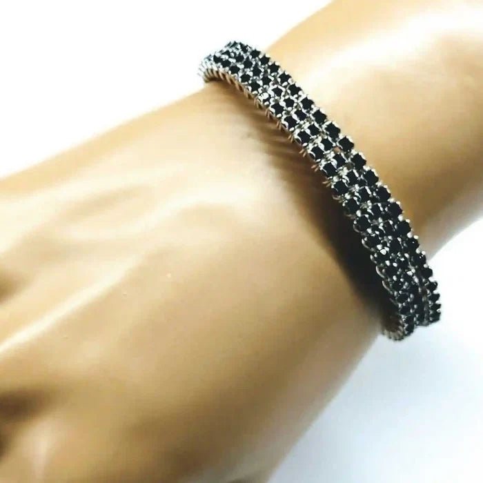 Wire Wrapped Copper Silver Black Crystal Rhinestone Bangle displayed on a hand showcasing its intricate design and sparkling crystals.