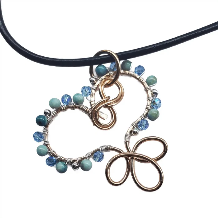 Wire Wrapped Copper Turquoise Heart Infinity Charm Necklace with turquoise beads and Swarovski crystals.
