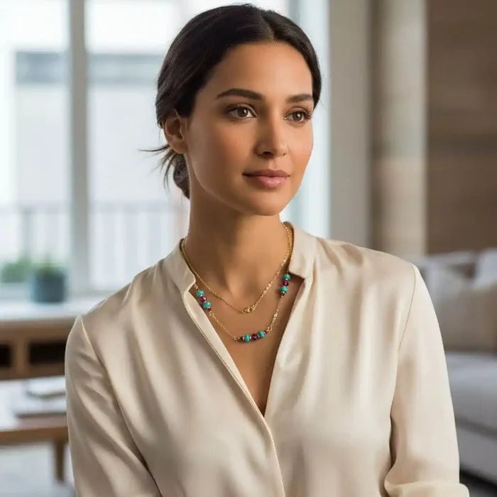 Wire Wrapped Gold Filled Pink Turquoise Gemstone Necklace worn by a model in a stylish blouse with natural light.