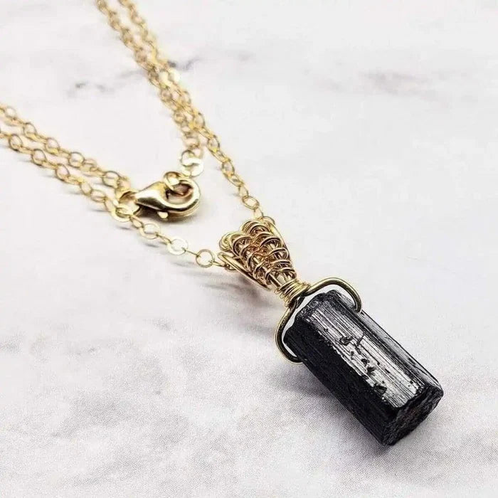 Wire Wrapped Raw Black Tourmaline Gemstone Necklace showcasing a raw black tourmaline pendant in elegant wire wrapping.