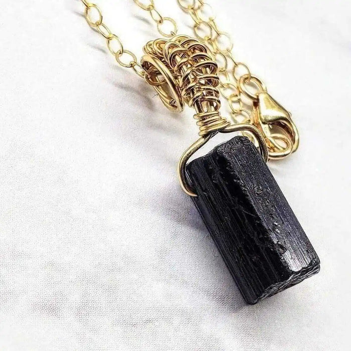 Wire Wrapped Raw Black Tourmaline Gemstone Necklace showcasing a raw black tourmaline crystal in elegant wire wrap.