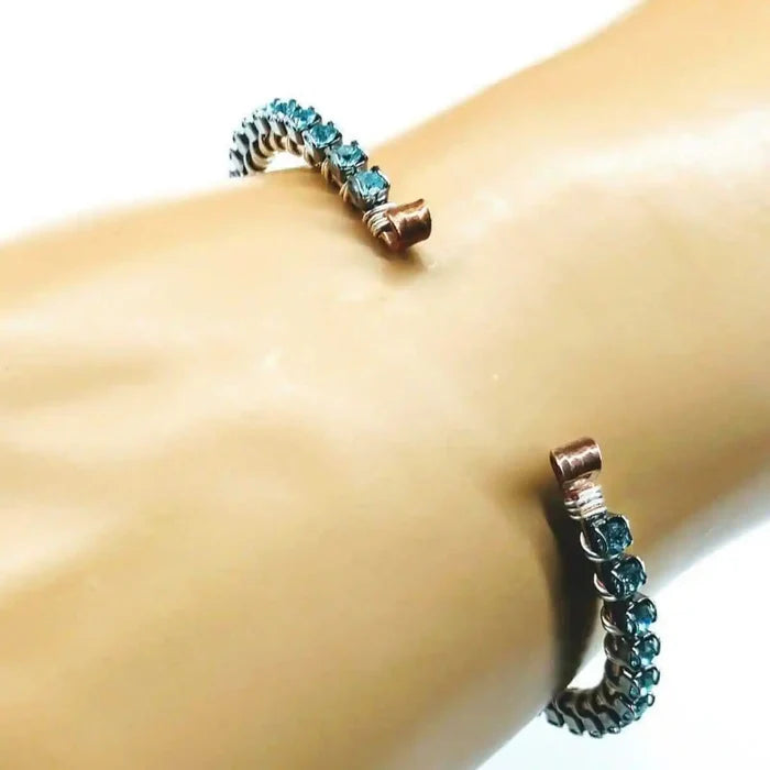 Wire Wrapped Turquoise Crystal Tennis Bangle Bracelet featuring aqua blue Swarovski-quality crystals on a hammered copper bangle.