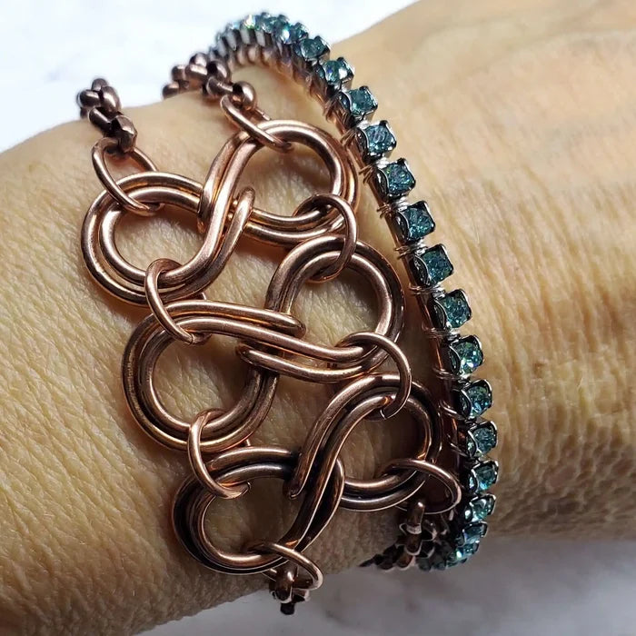 Wire Wrapped Turquoise Crystal Tennis Bangle Bracelet worn on wrist alongside a copper chain bracelet.