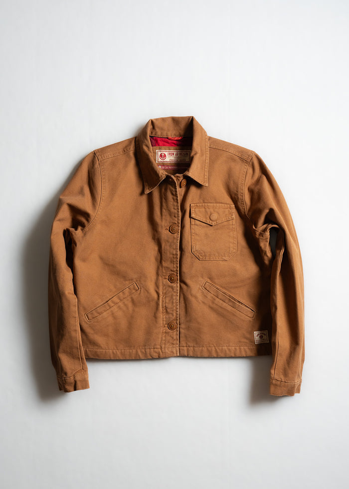 Brown canvas jacket with button closure, chest pocket, and two side pockets, displayed on a plain white background.