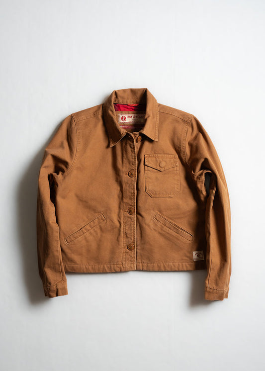 Brown canvas jacket with button closure, chest pocket, and two side pockets, displayed on a plain white background.