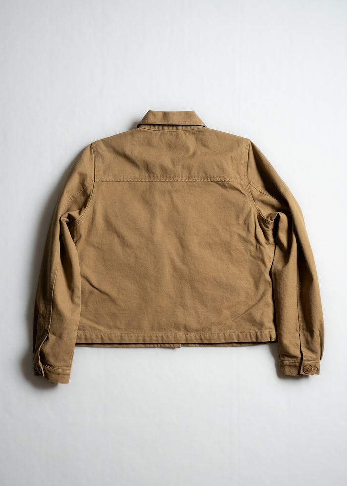 Tan jacket displayed on a white background, showcasing its back design with long sleeves and a classic collar.