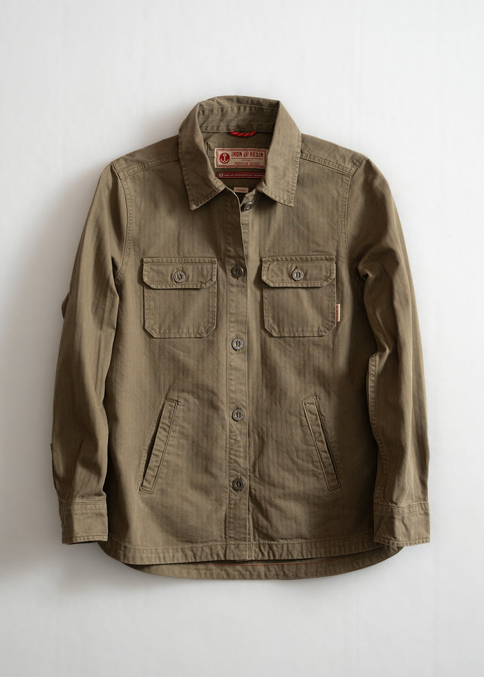 Khaki button-up jacket with two chest pockets and a collar, displayed against a white background. Iron & Resin label visible.