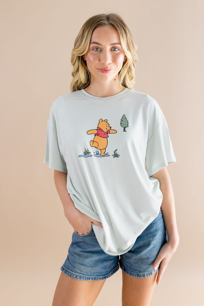 Female modeling the Women's Graphic Tee in Winnie the Pooh on Dew