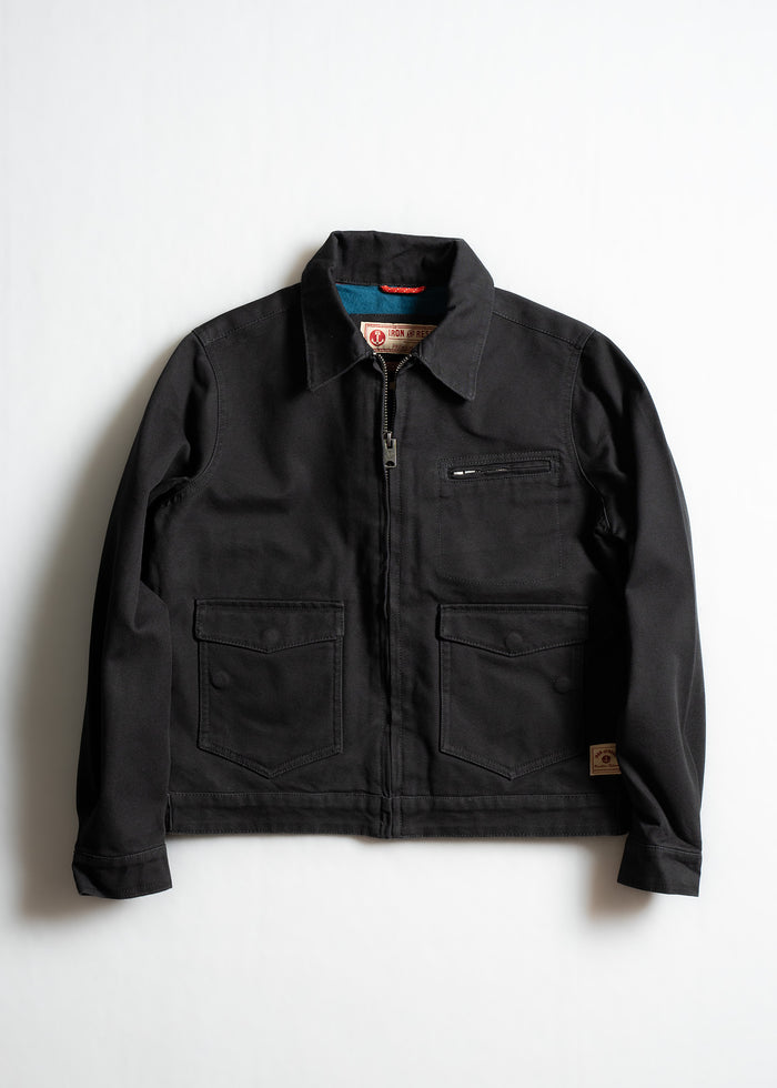 Black jacket with a front zipper, two large pockets, and a small chest pocket, laid flat on a white background.