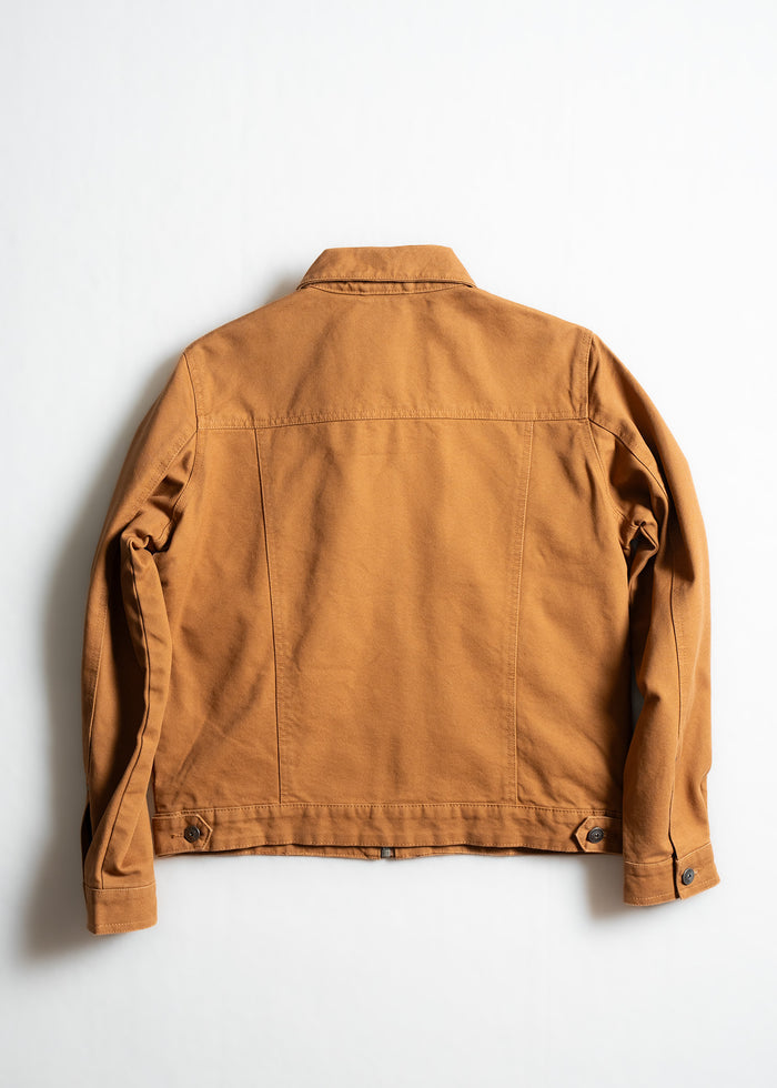 Brown denim jacket shown from the back on a white background, highlighting its classic design and stitching details.