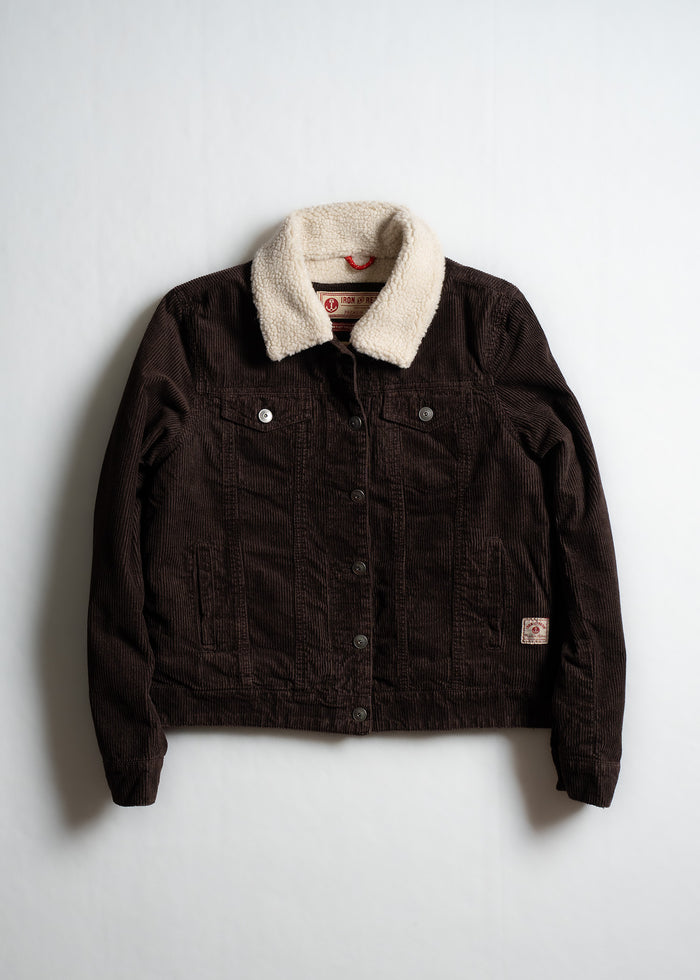 Dark brown corduroy jacket with a cozy white sherpa collar, buttoned front, and two chest pockets, laid flat on a white background.
