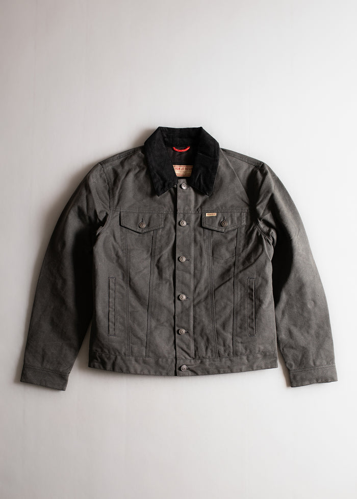 Dark gray button-up jacket with black corduroy collar, two chest pockets, and long sleeves, laid flat on a light background.