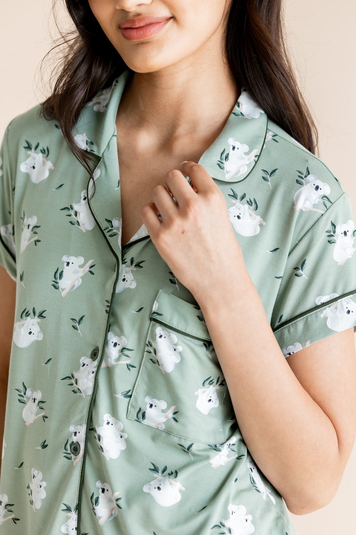 Model showcasing the collar of Women's Short Sleeve Pajama Set in Koala print on beige background