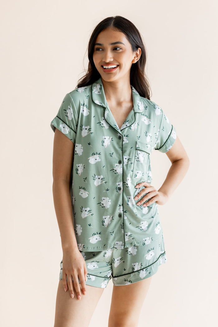 Model smiling in Women's Short Sleeve Pajama Set in Koala print on beige background