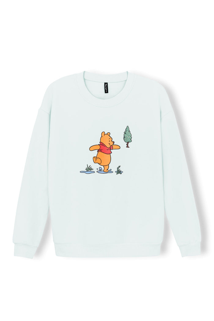 Light green women's sweatshirt with winnie the pooh character in the middle