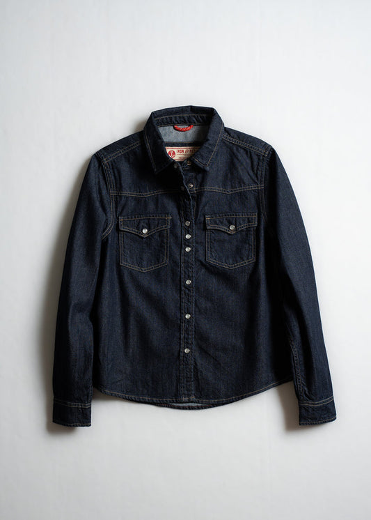 Dark denim shirt with button closure and two chest pockets, displayed against a plain white background.