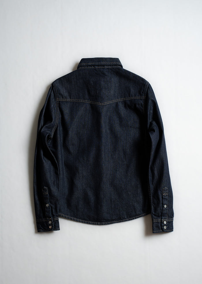 Dark denim shirt displayed on a white background, showing back details and long sleeves with buttoned cuffs.