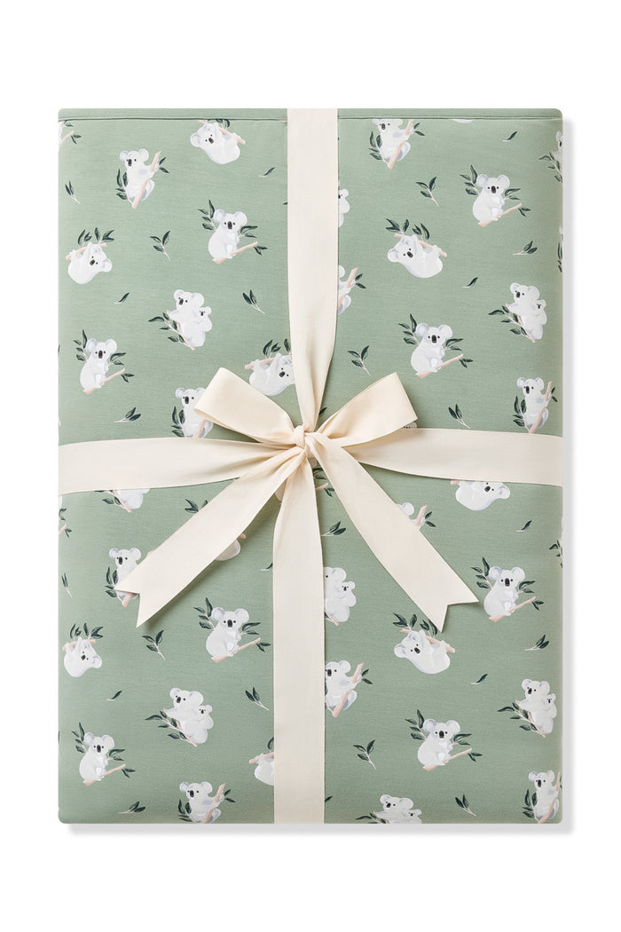 Youth Blanket in Koala 2.5 shown wrapped in a linen bow