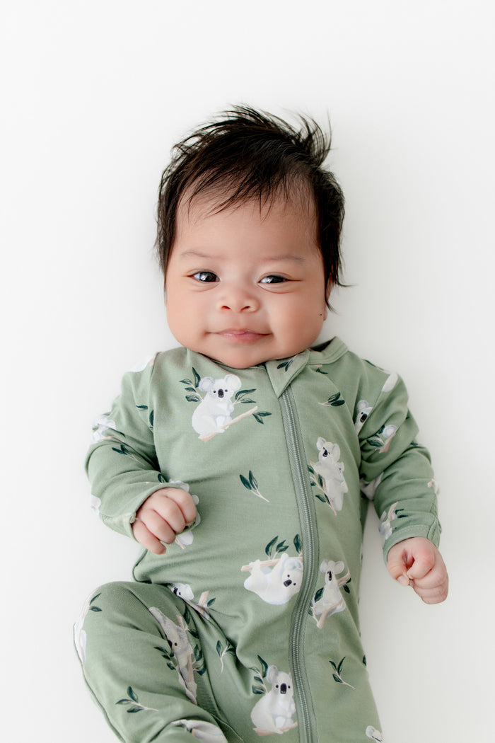 Close up of newborn wearing the Zippered Footie in Koala